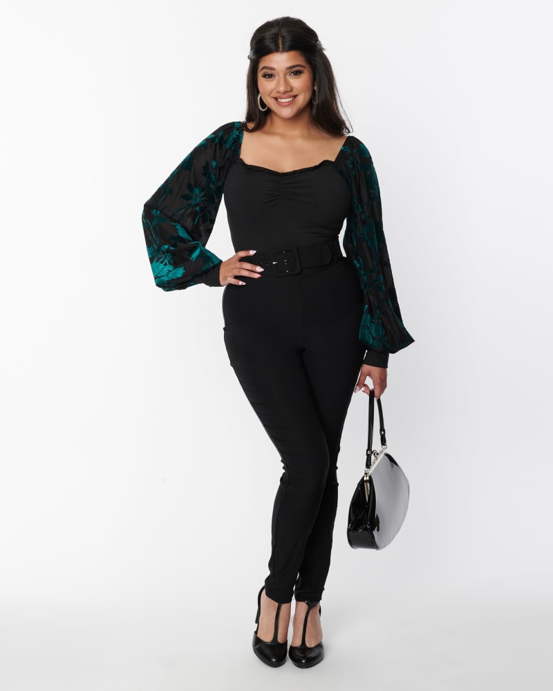 Front of a model wearing a size XL Unique Vintage Black Belted Rizzo Cigarette Pants in Black by Unique Vintage. | dia_product_style_image_id:329160